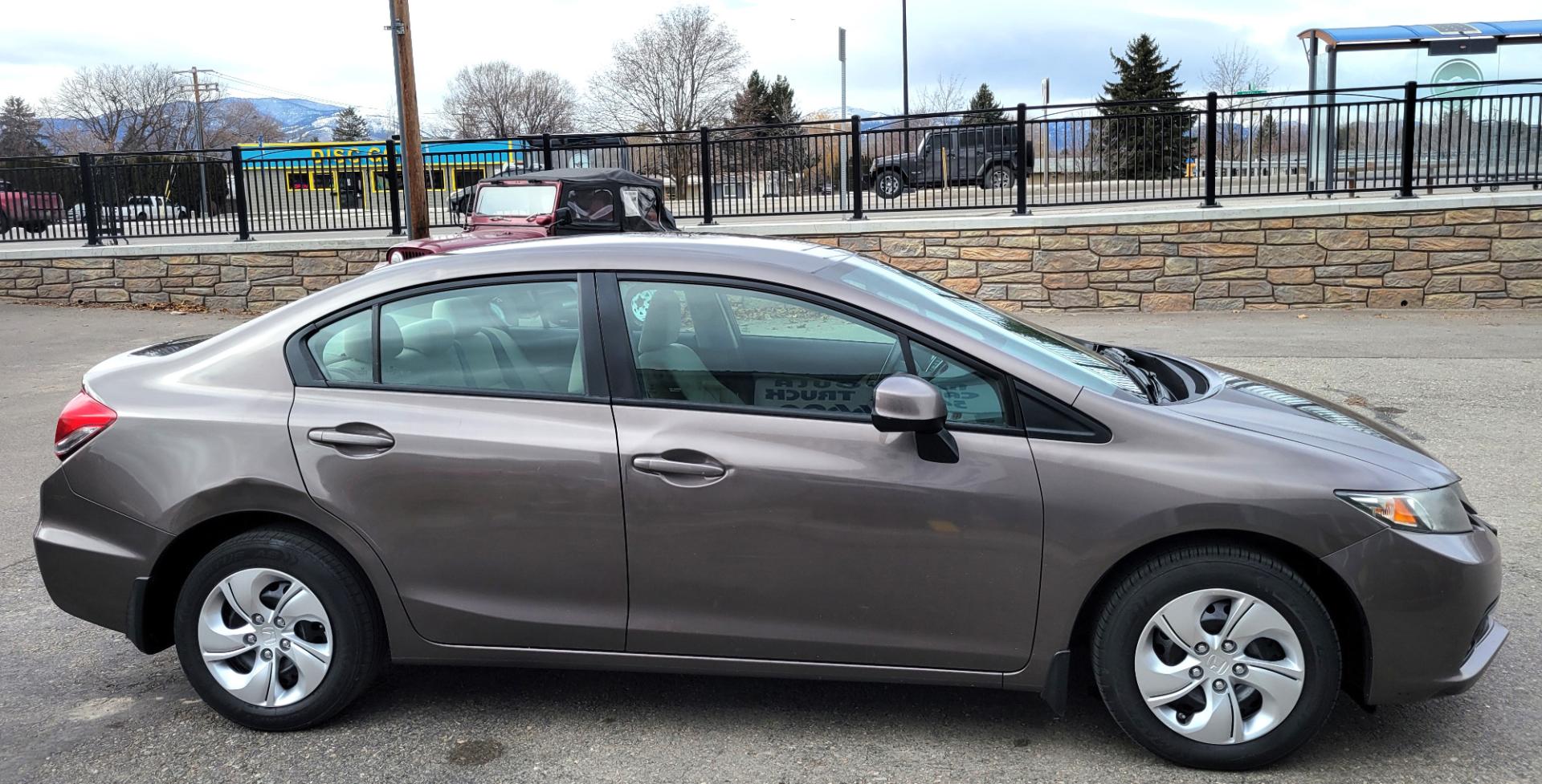 2013 Brown /Tan Honda Civic LX (2HGFB2F57DH) with an 1.8L I4 engine, 5 Speed Automatic transmission, located at 450 N Russell, Missoula, MT, 59801, (406) 543-6600, 46.874496, -114.017433 - Photo#2